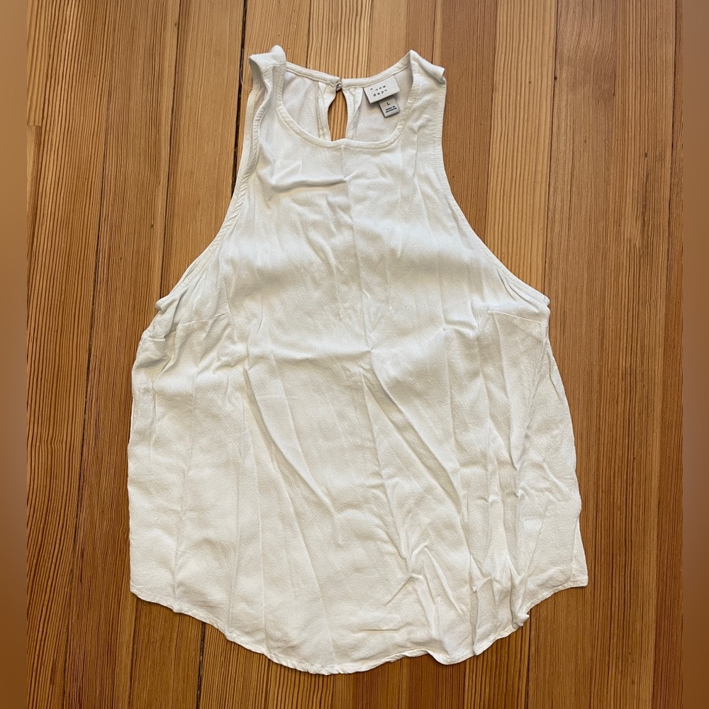 Off-white dressy tank.